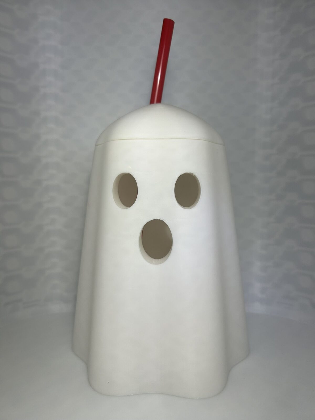 White ghost drink can cover with a domed lid and straw