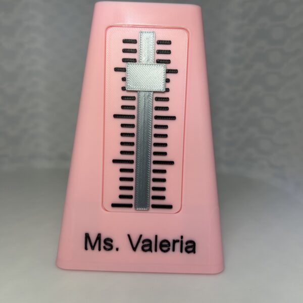 Pink 3D printed metronome pen holder personalised with the name Ms. Valeria