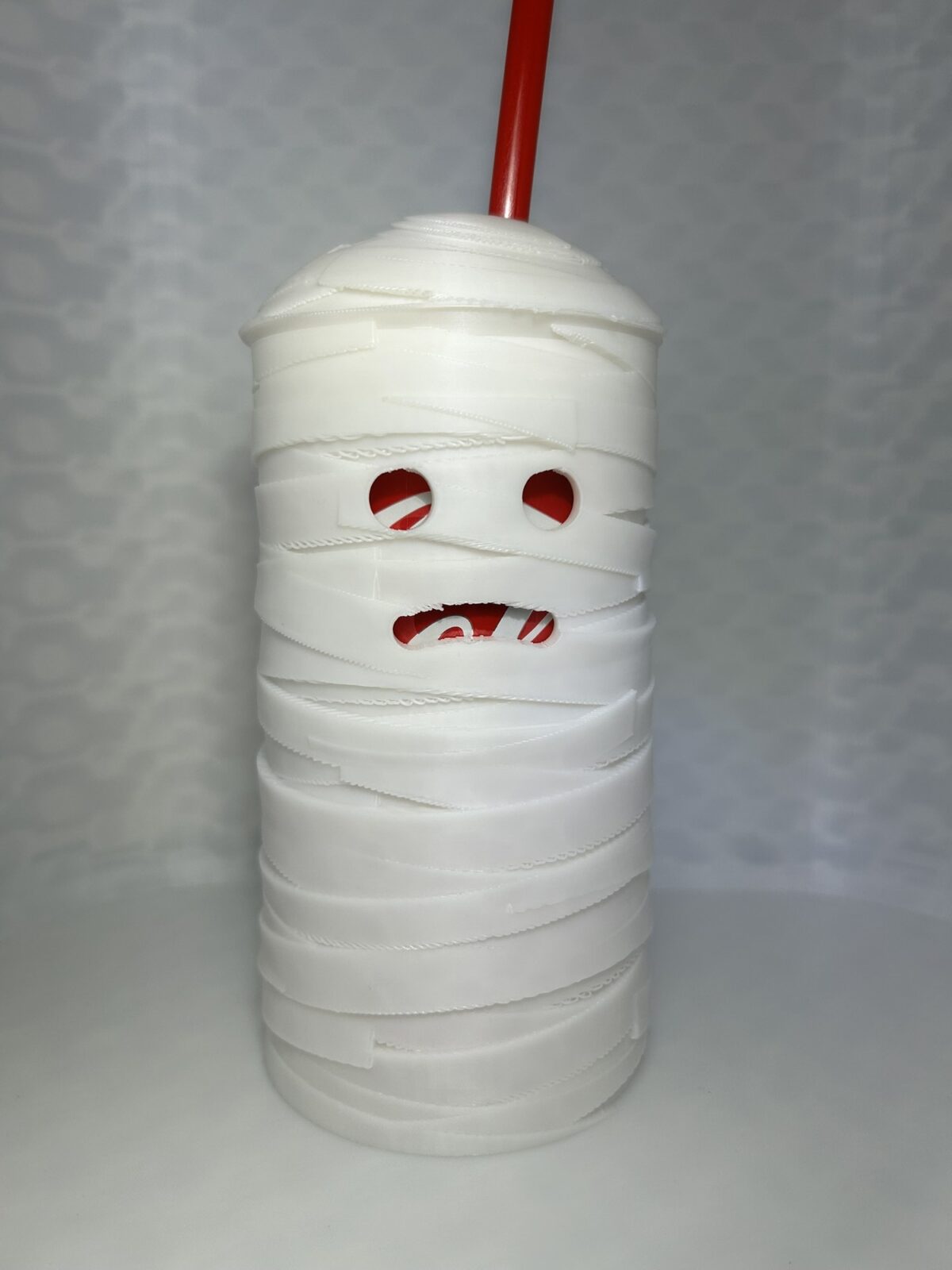 White mummy drink can cover with bandage wrap, lid and straw